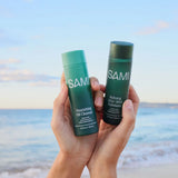 SAMI Refine & Nourish Bundle featuring Nourishing Oil Cleanser and Refining AHA + BHA Exfoliator held at the beach,  for glowing skin and gentle exfoliation