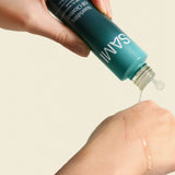 SAMI facial oil cleanser pouring onto hand demonstrating silky nourishing formula