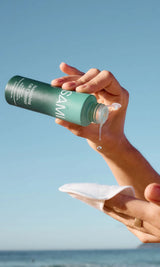 SAMI Nourishing Oil Cleanser poured onto reusable cotton round, gentle oil cleanser for removing makeup, and effortless no-rinse cleansing outdoors